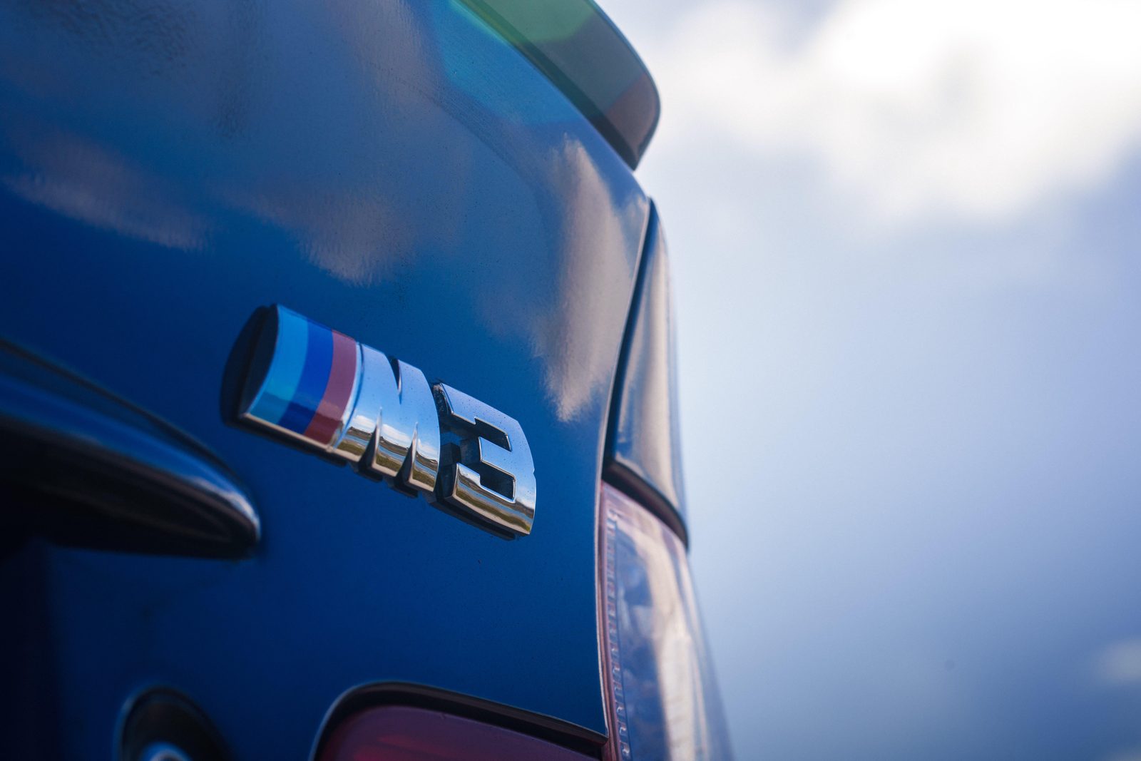 The M3 badge on Brian's Interlagos Blue E46.